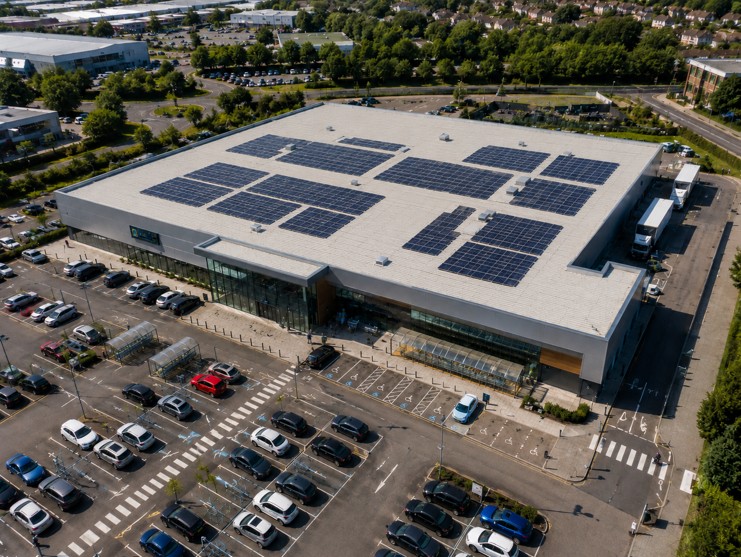 Aerial view of a UK supermarket with solar panels covering the rooftop
